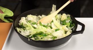 Chopped cabbage in an iron skillet.